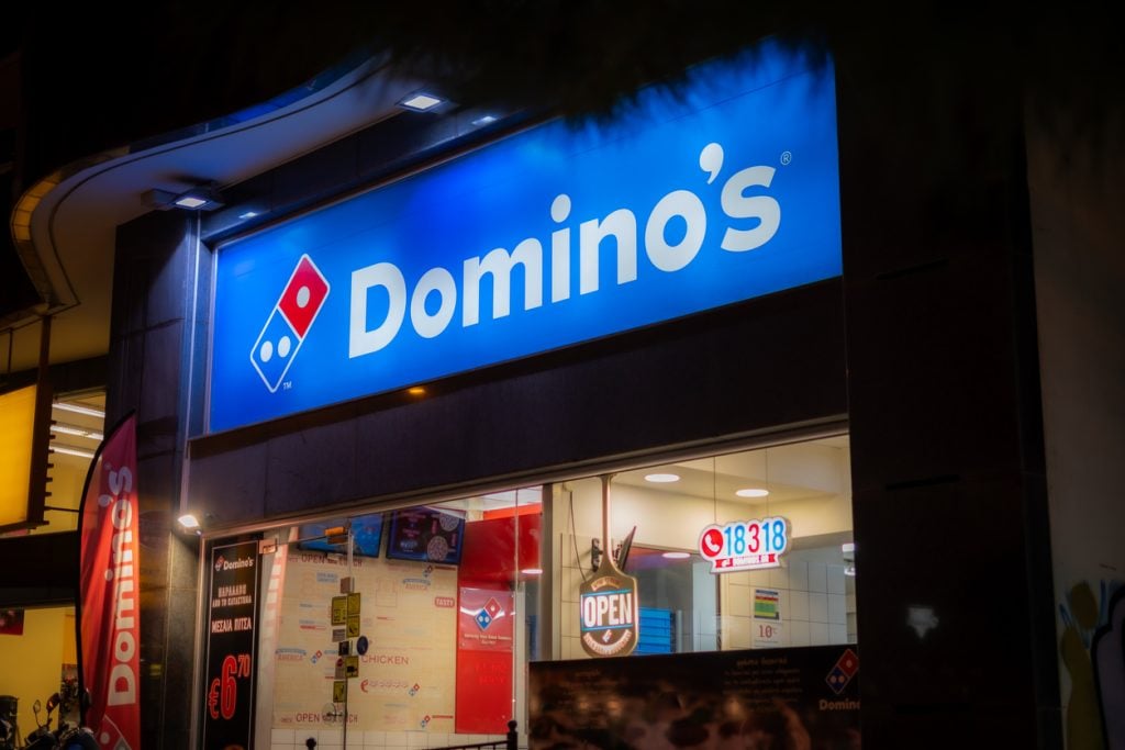 A former Domino’s delivery driver sued his employer for wage theft claiming the Massachusetts location underpaid their delivery drivers.