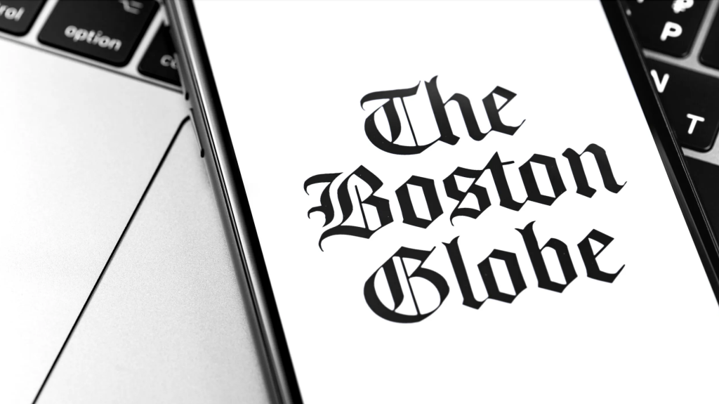 The Boston Globe settled a wage dispute with its former president, who claimed the company fired him to avoid paying him earned his wages.